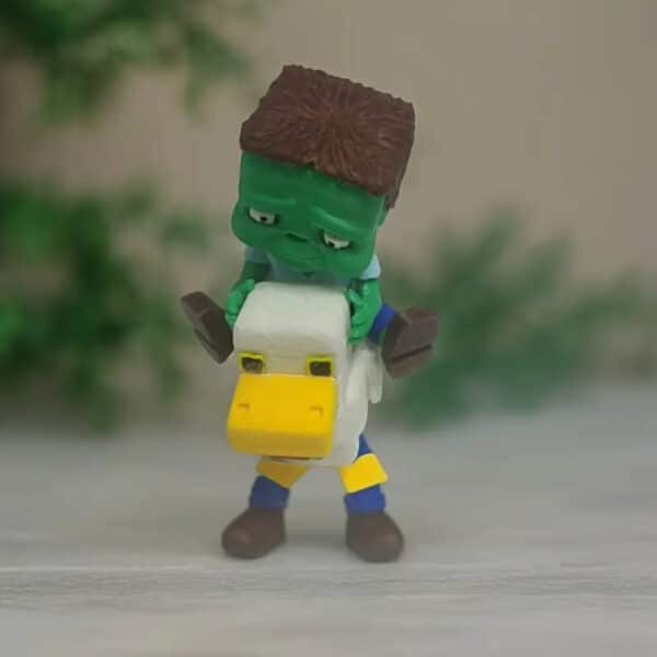 Articulated 3D Printed Green Monster Riding with White Chick - Image 2