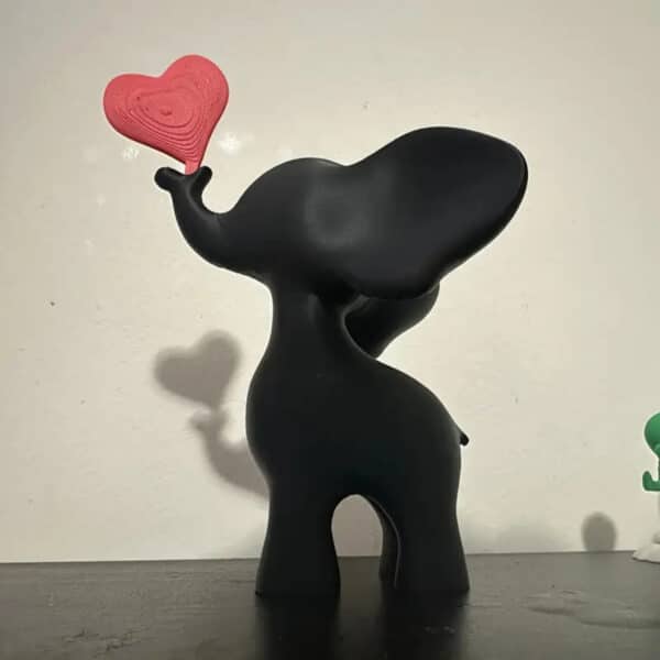3D Printed Modern Playful Elephant with Holding Red Heart - Image 4